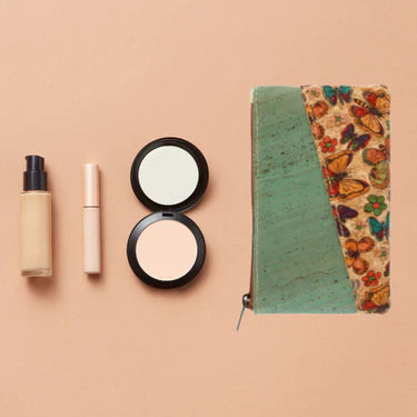 FREDA compact purse with makeup pieces beside